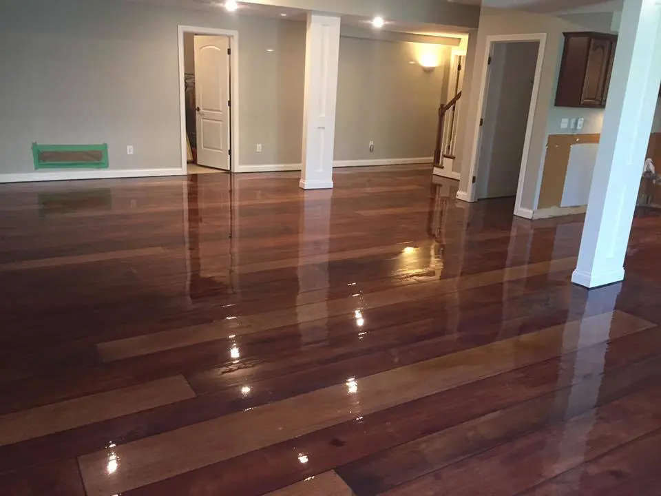 Polished hardwood floor in empty living room.