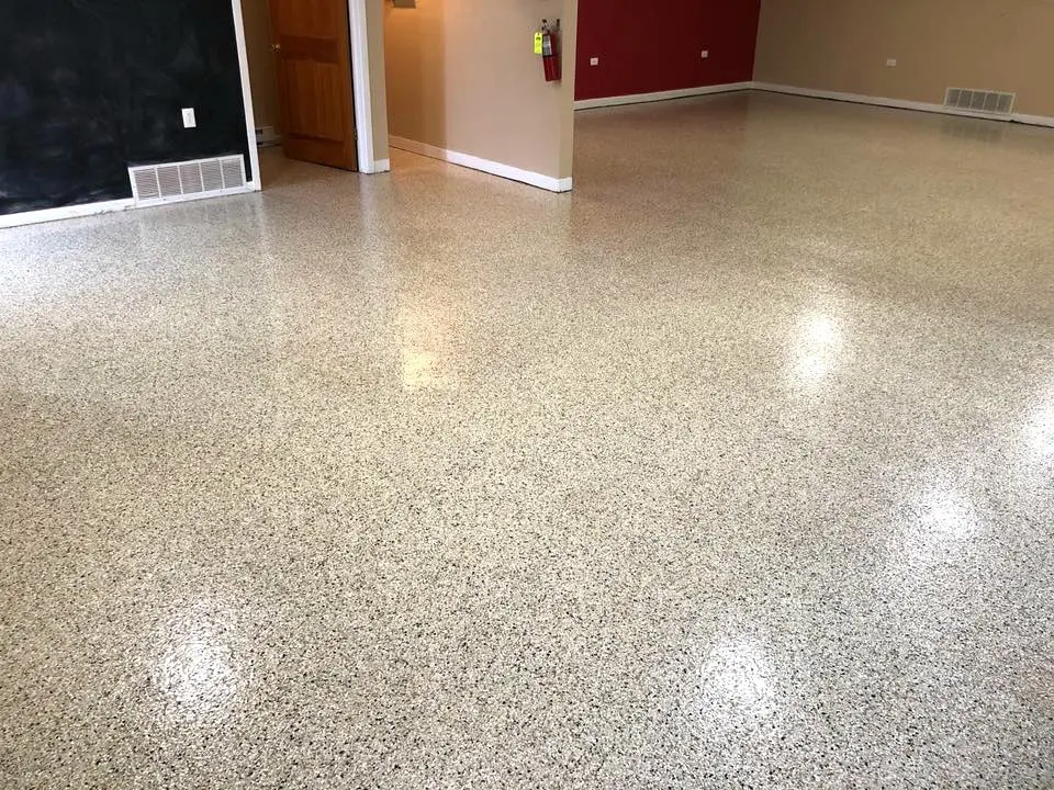 Empty room with polished speckled flooring.