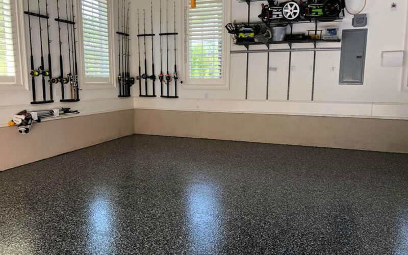 Organized garage with fishing rods and tools.