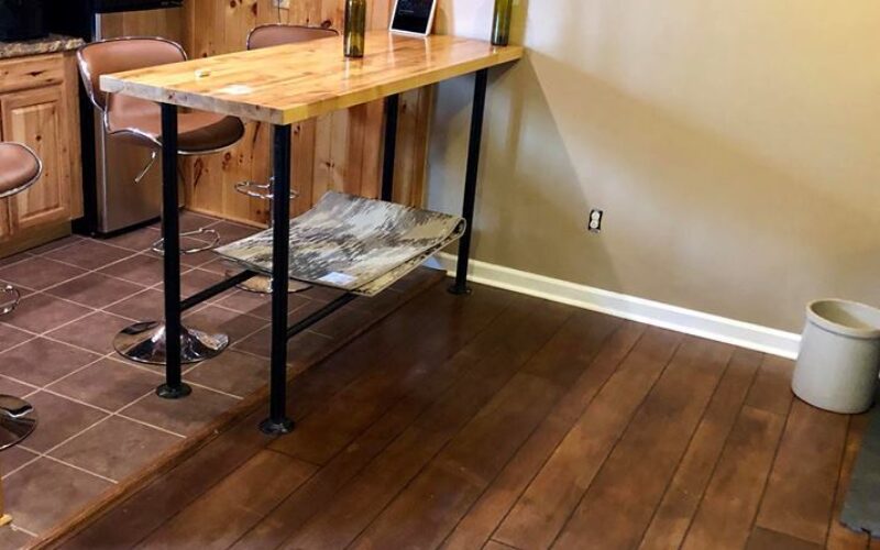 Home bar area with wooden counter.