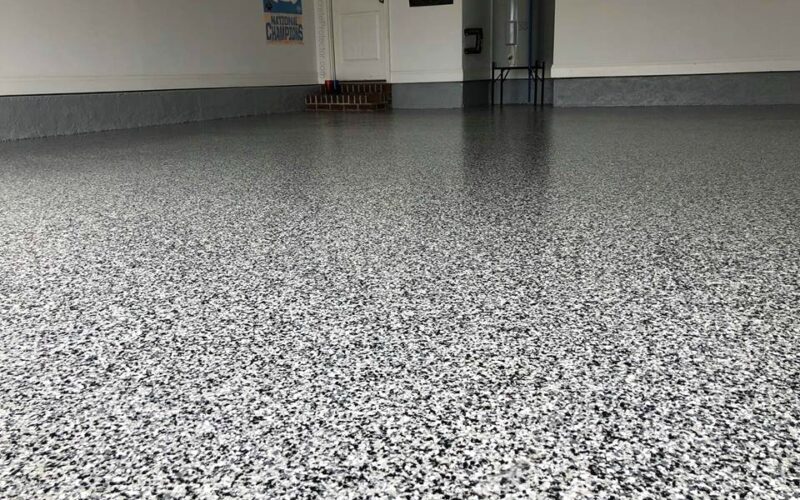 Speckled epoxy garage floor, clean and shiny.