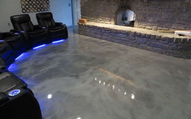 Home theater with polished concrete floor.