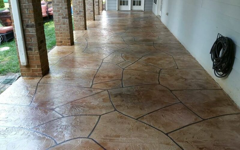 Stamped concrete patio with brick columns.