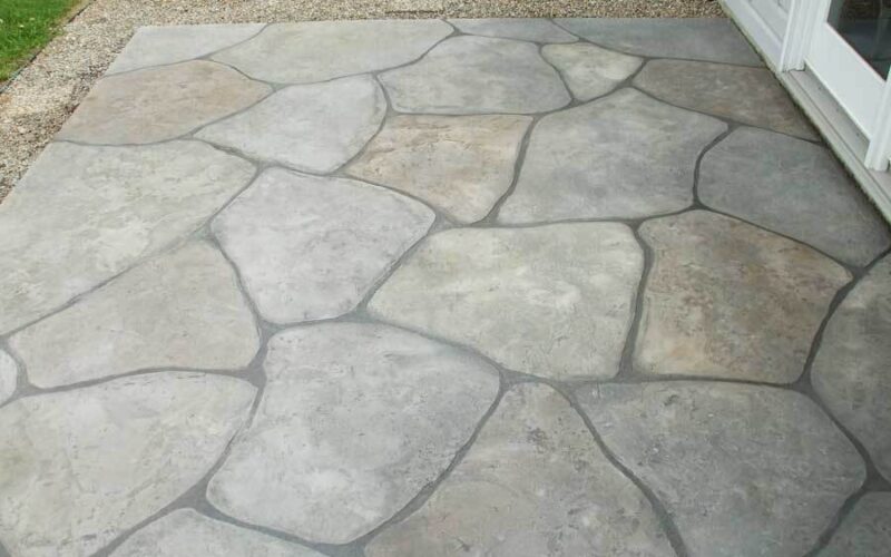 Stone patio with irregularly shaped tiles.