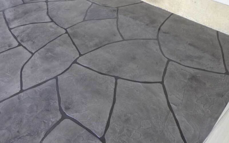 Gray stone-patterned textured floor surface.