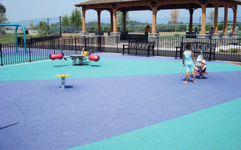 Children playing in colorful playground area.