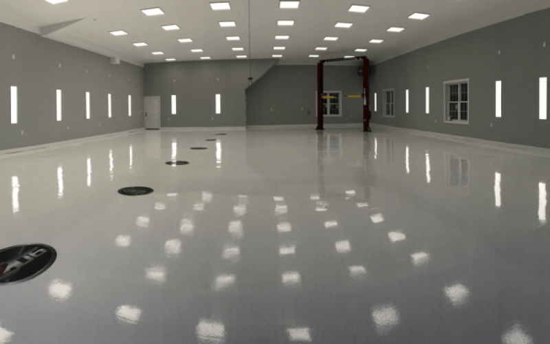 Spacious, empty, modern room with gray walls.